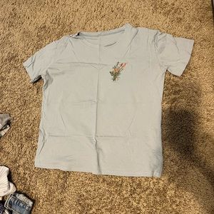 Blue T shirt with a flower